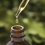 A drop of product in a natural setting in the background.