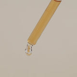 Serum drop of product about to drip.