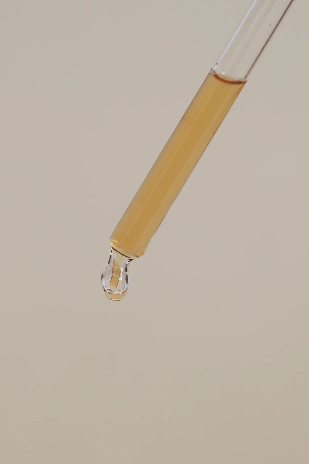 Serum drop of product about to drip.