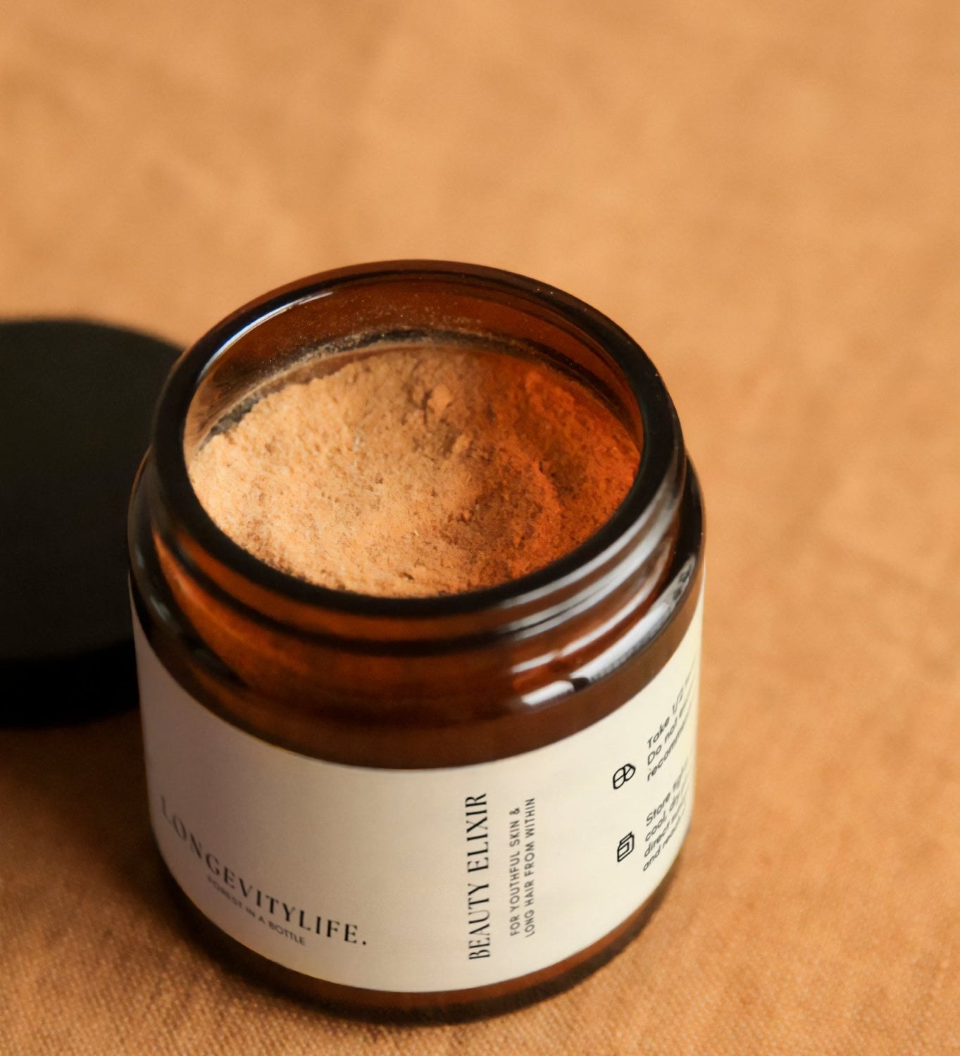 Beauty Elixir powder, made by LongevityLife, on fabric.