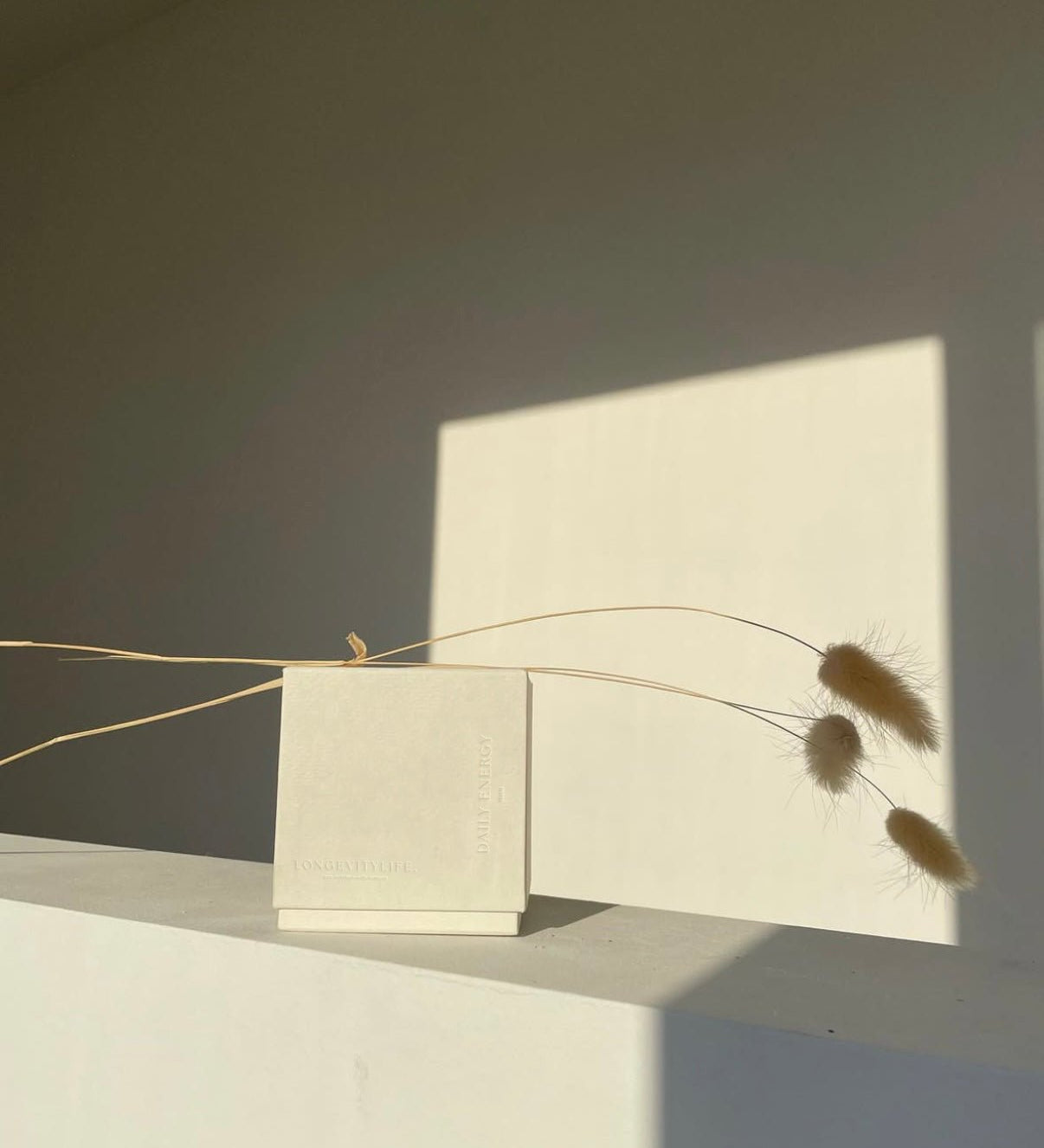 NMN capsule box with plants.