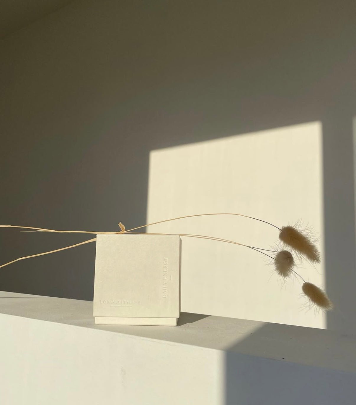 NMN capsule box with plants.