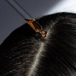 A girl using Hair Serums, made by LongevityLife.