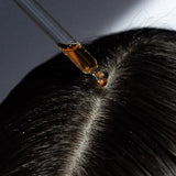 A girl using Hair Serums, made by LongevityLife.