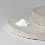 A plate with a mound of NMN powder resting on its surface.