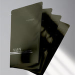 A close up of the NMN green bag, including three of them.