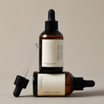 Two perfect skin products on top of each other, with a tool.