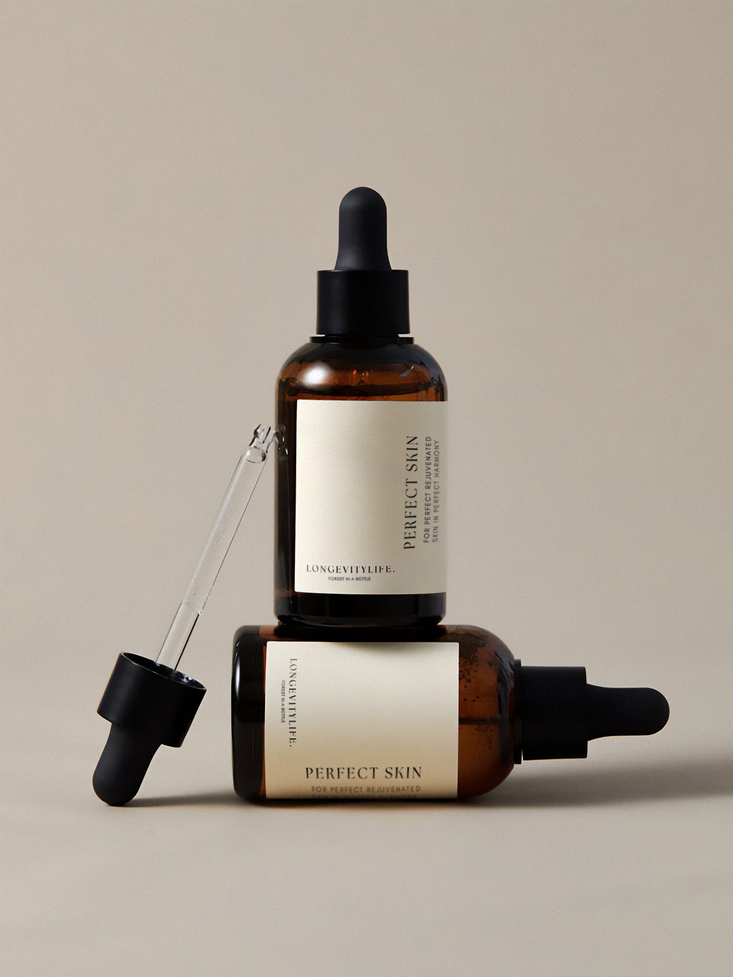 Two perfect skin products on top of each other, with a tool.