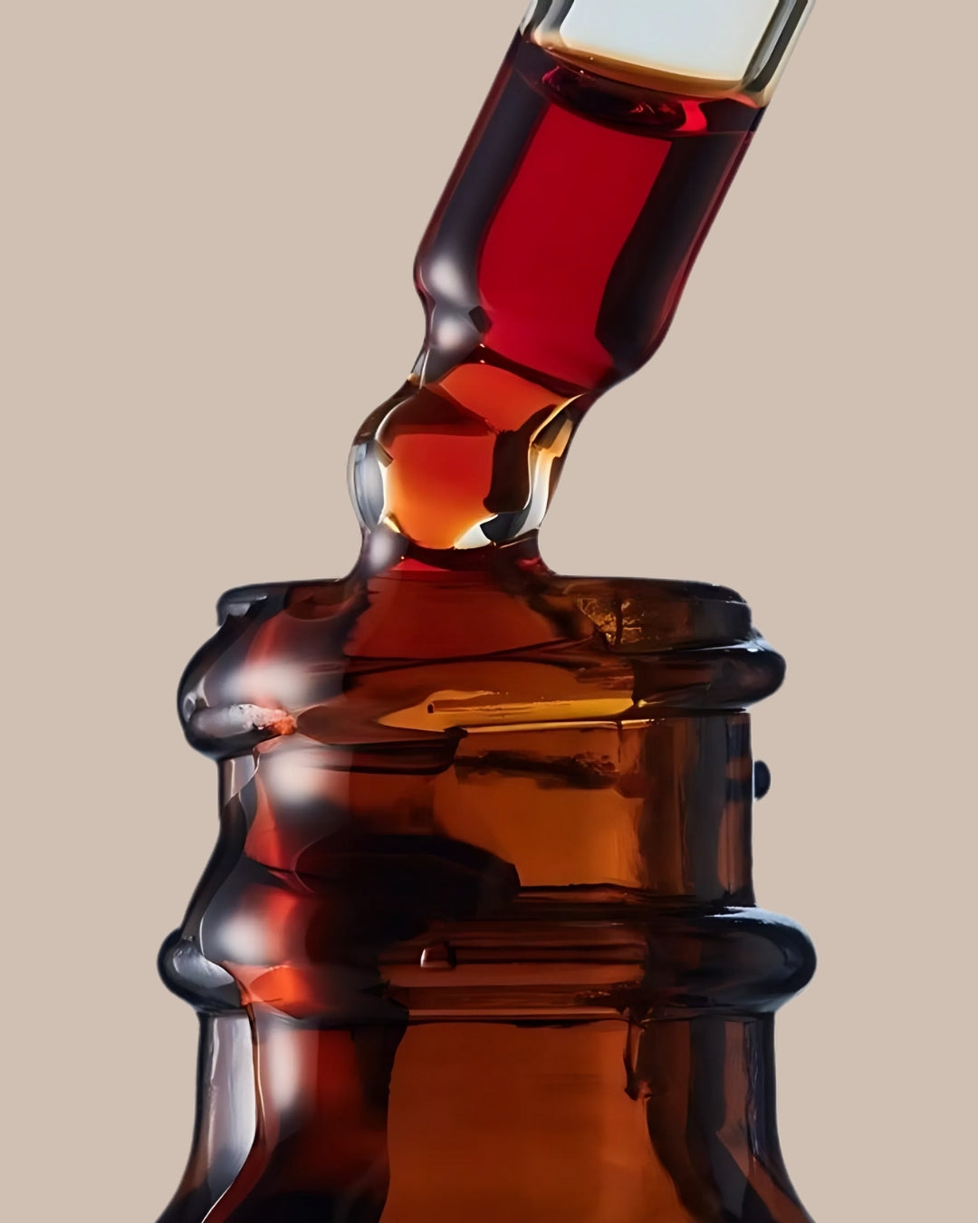 A bottle is pouring liquid into a clear glass, creating a stream of liquid as it fills the glass.