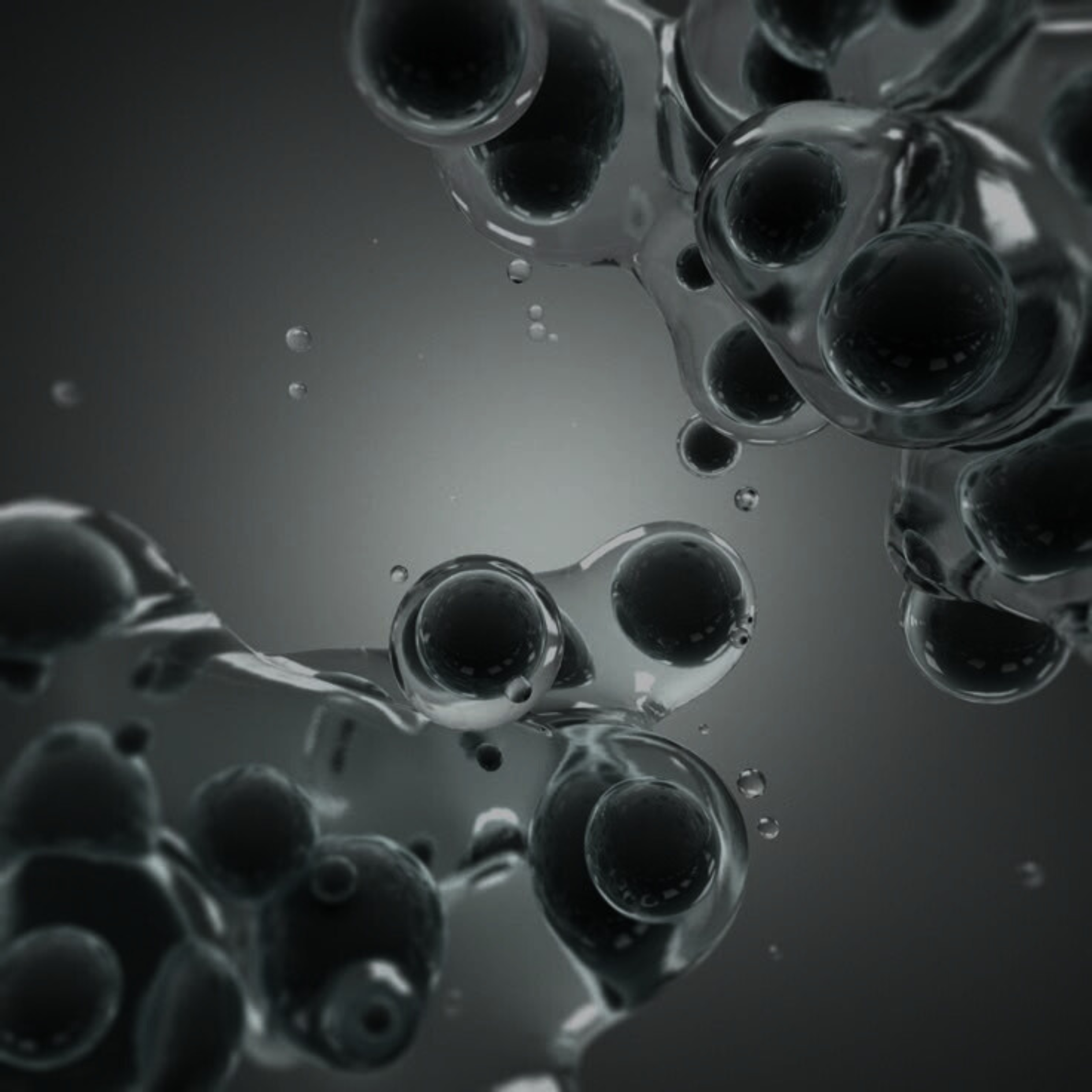 Close-up of black bubbles on a gray background.