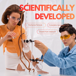 Two scientists wearing safety glasses at a laboratory apparatus