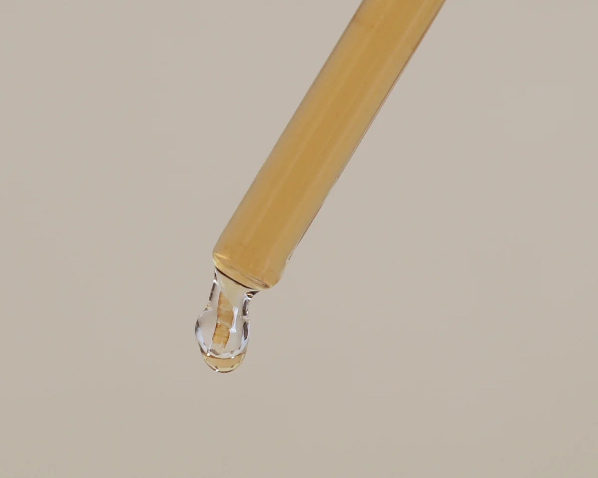 Serum drop of product about to drip.