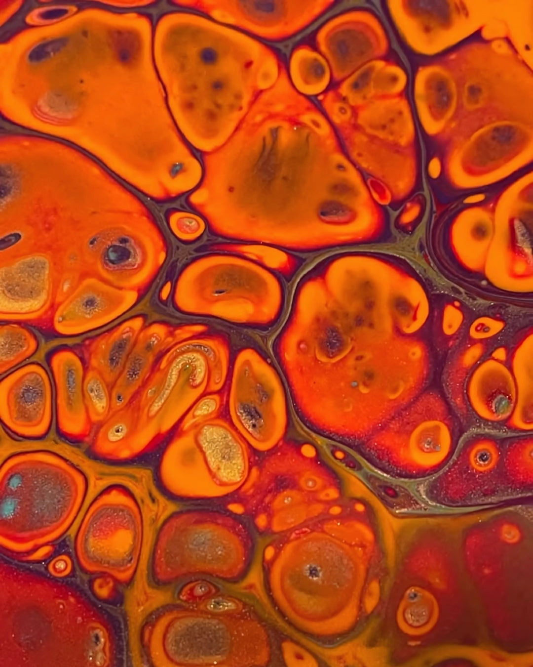 Colorful abstract artwork depicting floating orange and red bubbles in a dynamic composition.