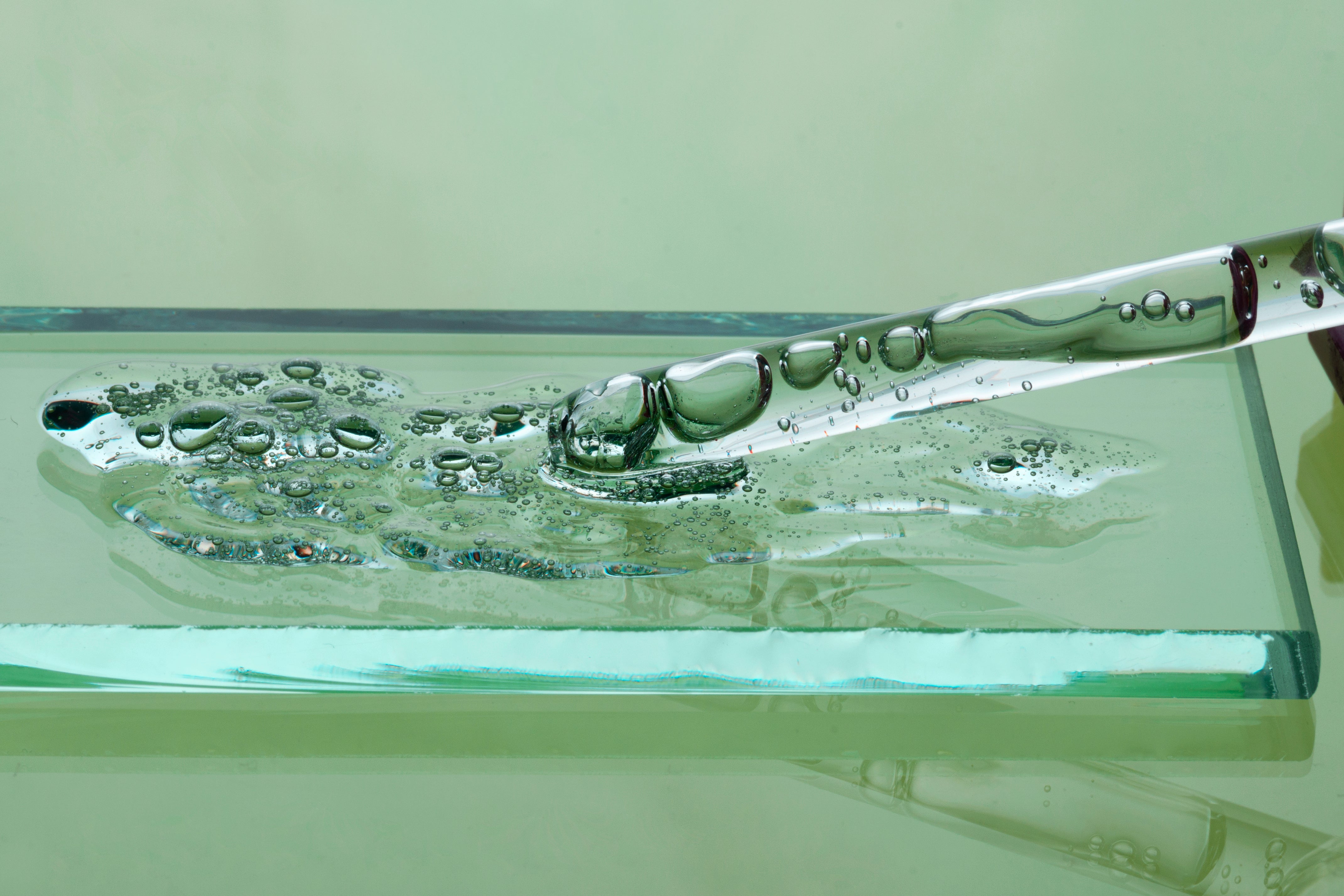 Glass with water droplets on a green background used in longevity life